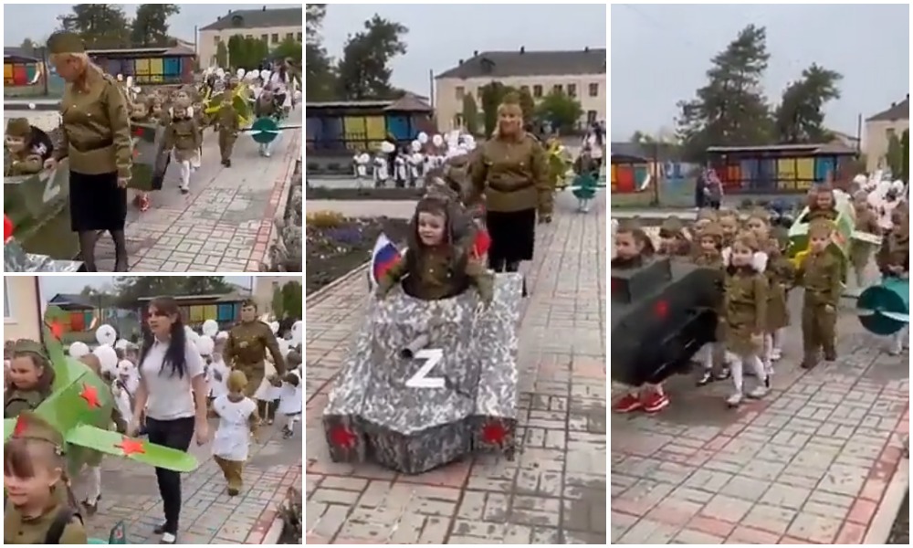 VIDEO. Rușii au îmbrăcat copii de grădiniță și educatoare în uniforme militare și i-au pus să defileze, de Ziua Victoriei, cu tancuri și avioane de carton cu litera Z pe ele